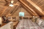 Master loft with mountain laurel railings and wooded views